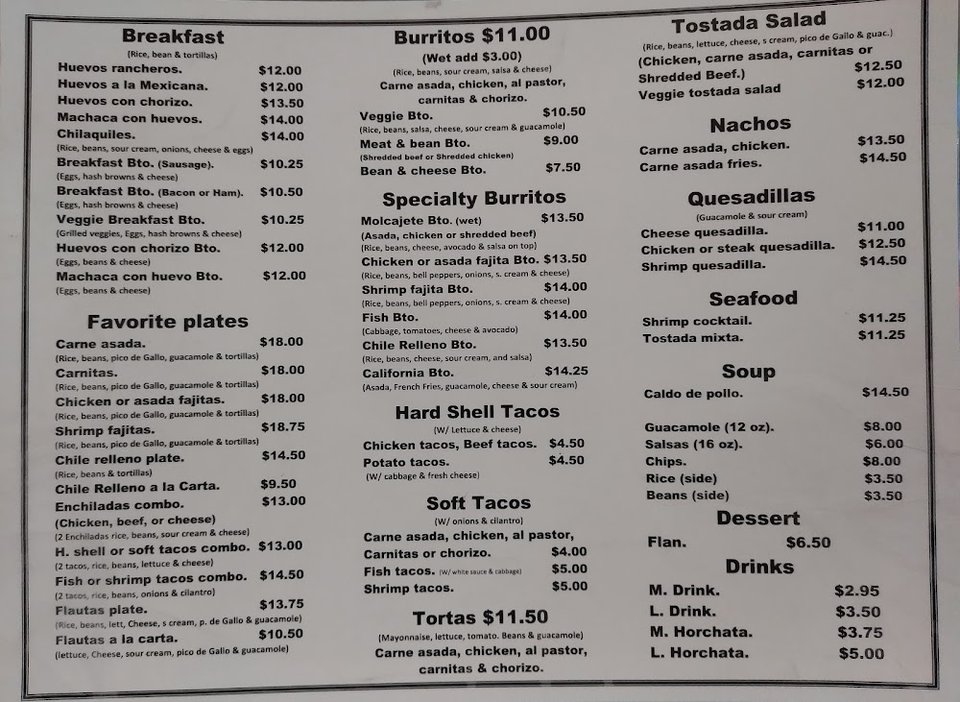 Menu board with breakfast, burritos, tacos, and tortas.